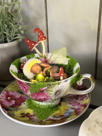 Sleeping baby Fairy in a cup